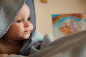 Paediatric orthopaedic check up baby under a blanket