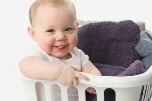 Baby & Child motor development from 15 months old to 4 years infant in a laundry basket