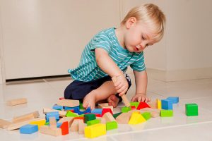 Baby & Child motor development from 15 months old to 4 years, infant playing with cube