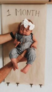 Newborn checkup babie hold in two hands